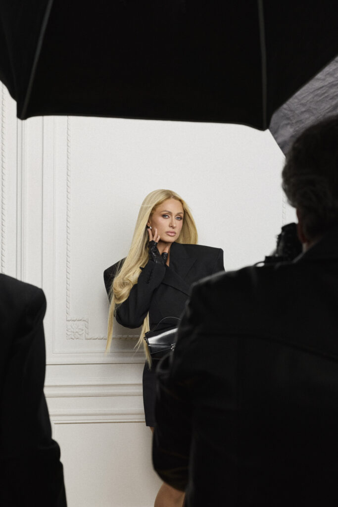 Karl Lagerfeld Spring–Summer 2026 campaign featuring Paris Hilton at the Maison in Paris, showcasing black‑and‑white signature styles and vibrant seasonal looks.