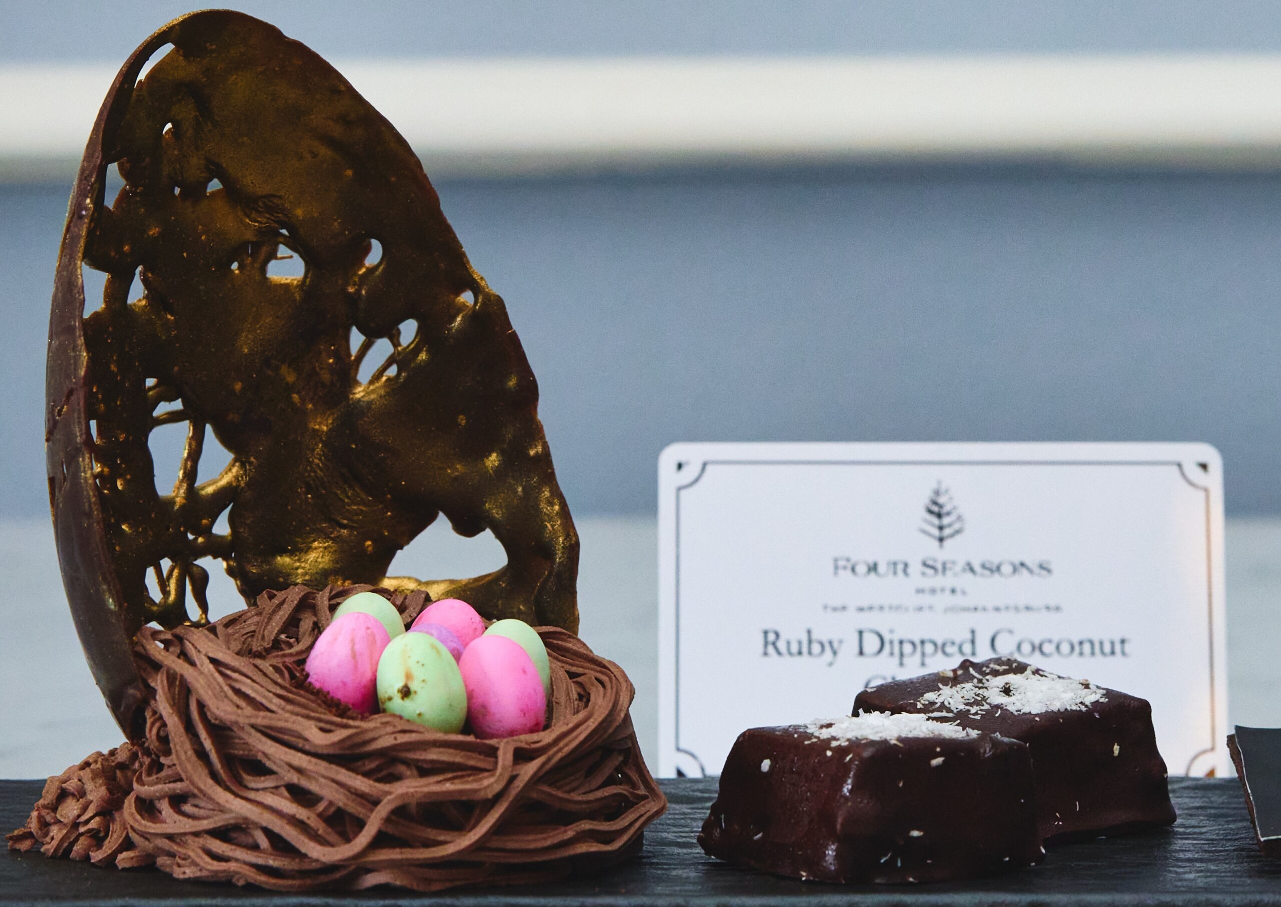 Easter Egg next to The Four Seasons Place card