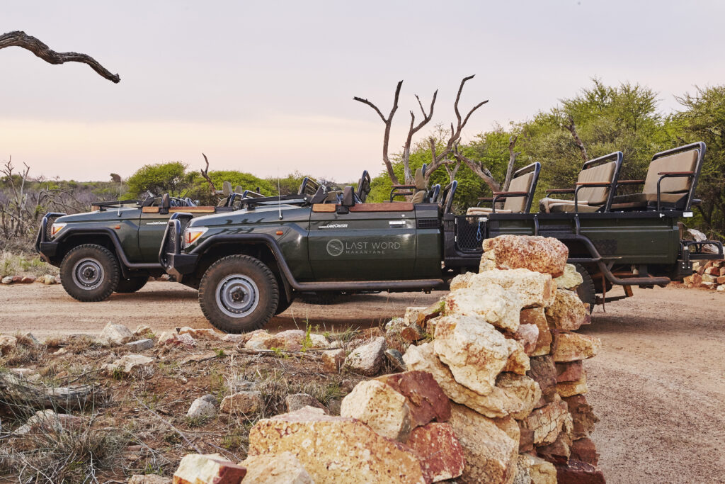 Preferred Hotels & Resorts: Where Legacy Meets Locality 10 Game drive vehicles parked at safari