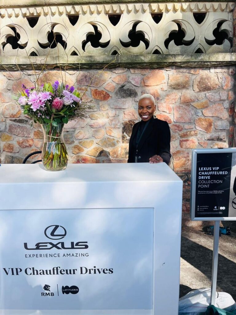 Woman standing behind chauffeur collection point counter