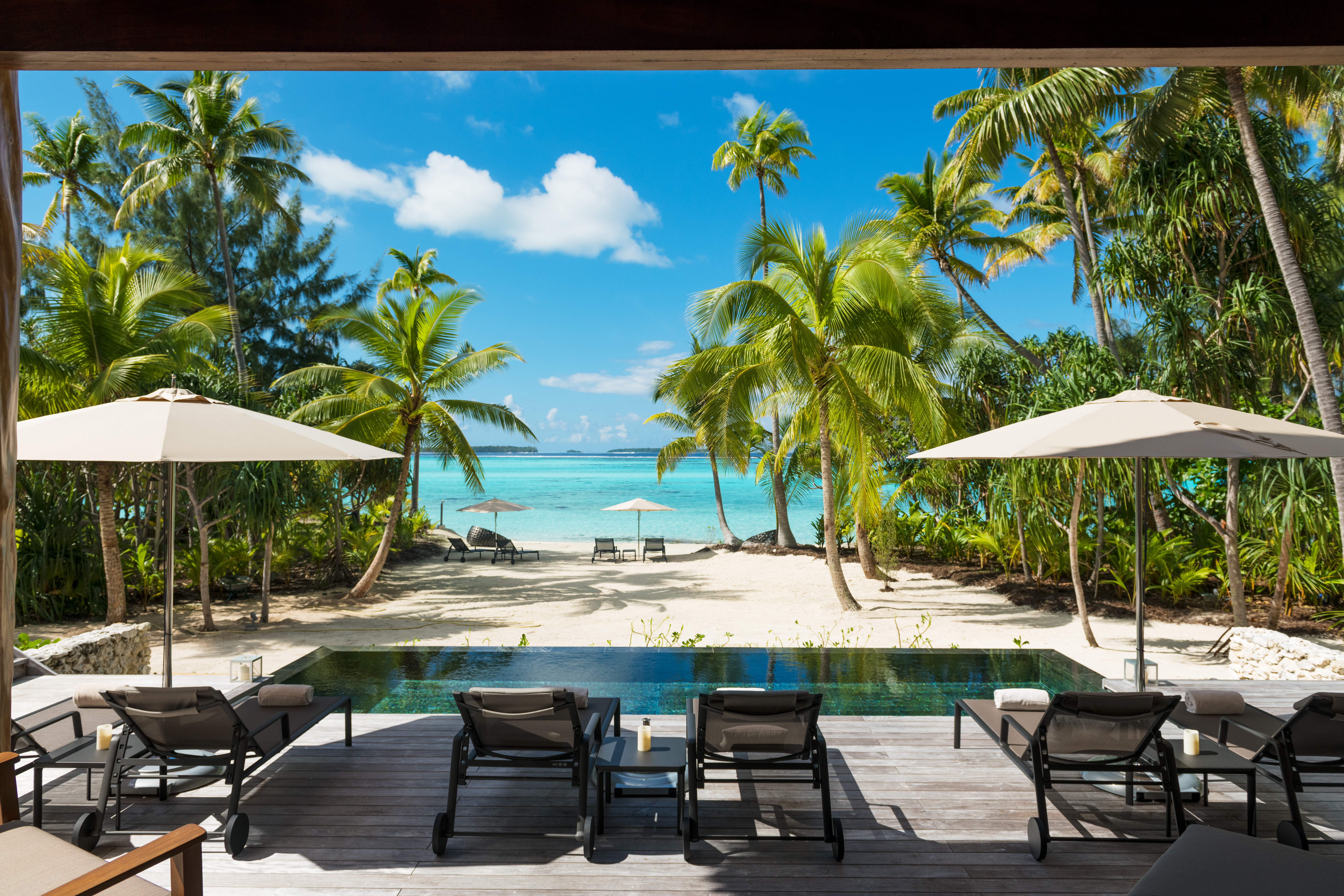 View of ocean and palm trees from luxury villa deck with private pool Preferred Hotels and Resorts