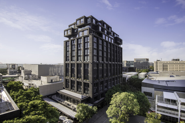 Hyde Johannesburg Rosebank: Where Urban Luxury, Architecture, and Experience Converge 5 The Bank building in Rosebank, Johannesburg, is a restored former banking institution turned modern mixed-use development. Its dark, textured façade reflects the original structure’s history as a bank, while contemporary architectural additions and greenery highlight its transformation into a premium urban landmark combining office, hotel, and lifestyle spaces.