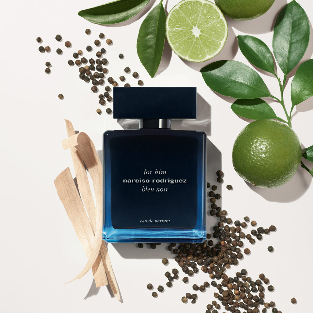 A curated selection of luxury men’s fragrance bottles including Issey Miyake L’Eau d’Issey Pour Homme Noir Ambre, Zadig & Voltaire This Is Him! Eau de Toilette, and Narciso Rodriguez for Him Bleu Noir Parfum, styled as a sophisticated edit of modern masculine scents featuring warm amber, woody, spicy, and musk profiles.