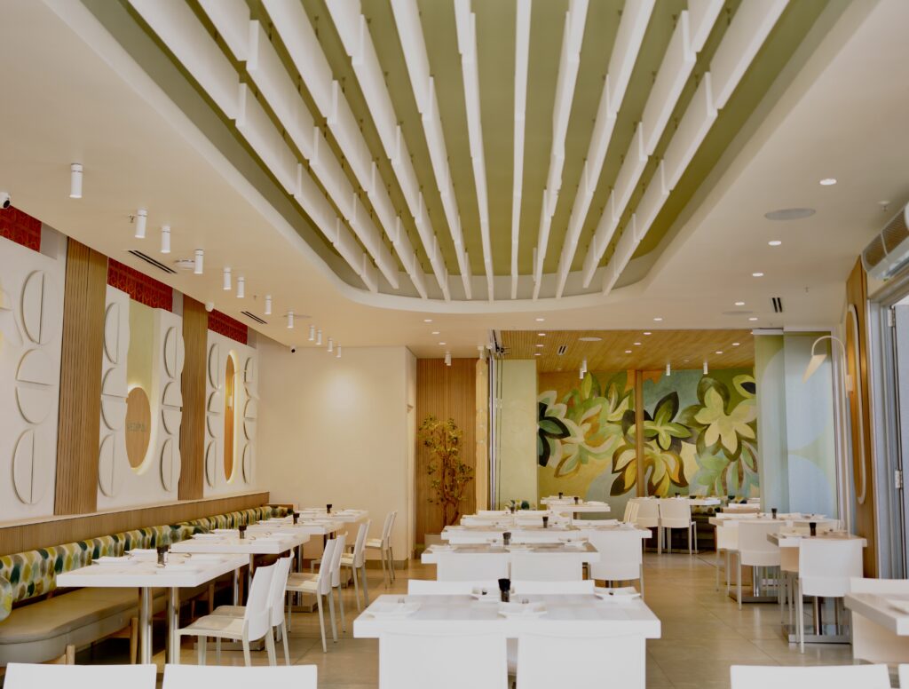 A contemporary dining setting at Mezepoli in Melrose Arch, Johannesburg, featuring modern Mediterranean cuisine served in a stylish, relaxed urban restaurant atmosphere
