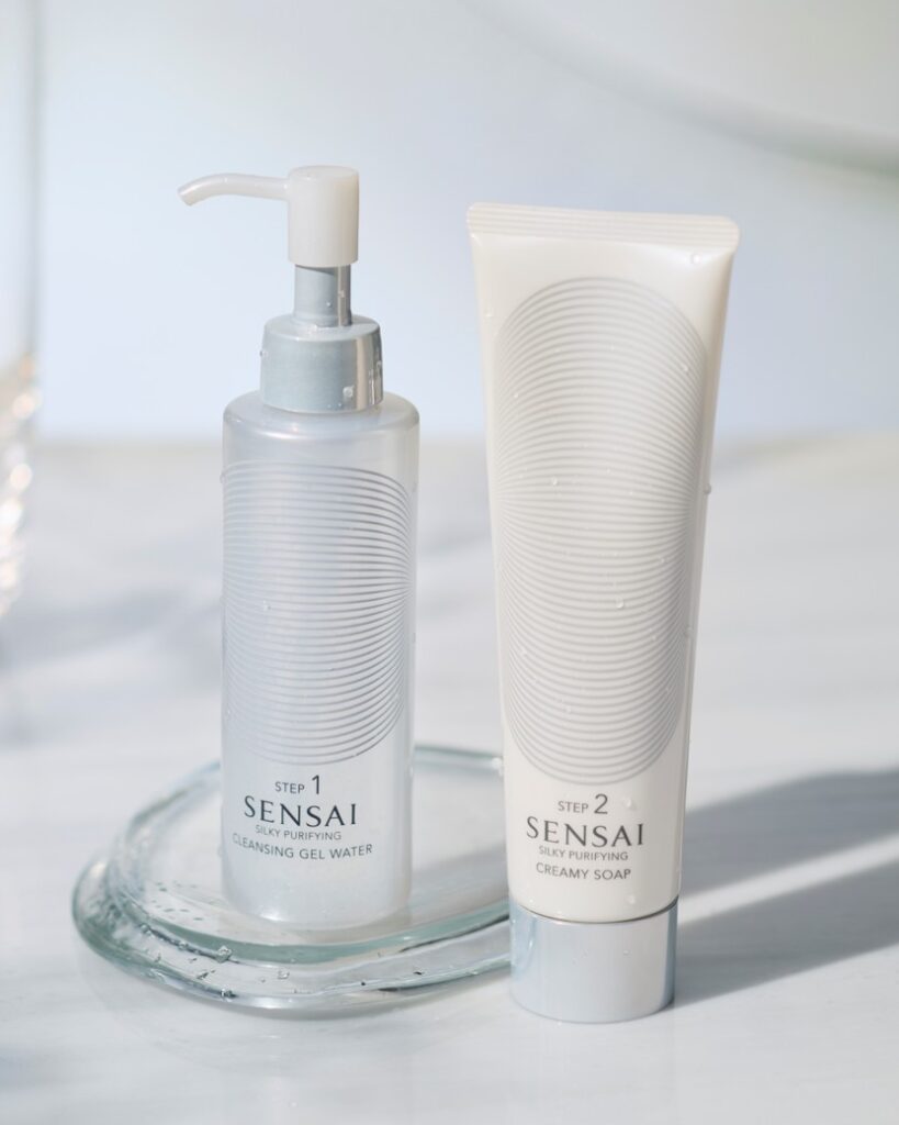 A luxury SENSAI skincare set featuring Silky Purifying Cleansing Gel Water and Silky Purifying Creamy Soap, presented as an elegant double cleansing ritual for men with a focus on refined grooming, soft textures, and premium Japanese skincare packaging.