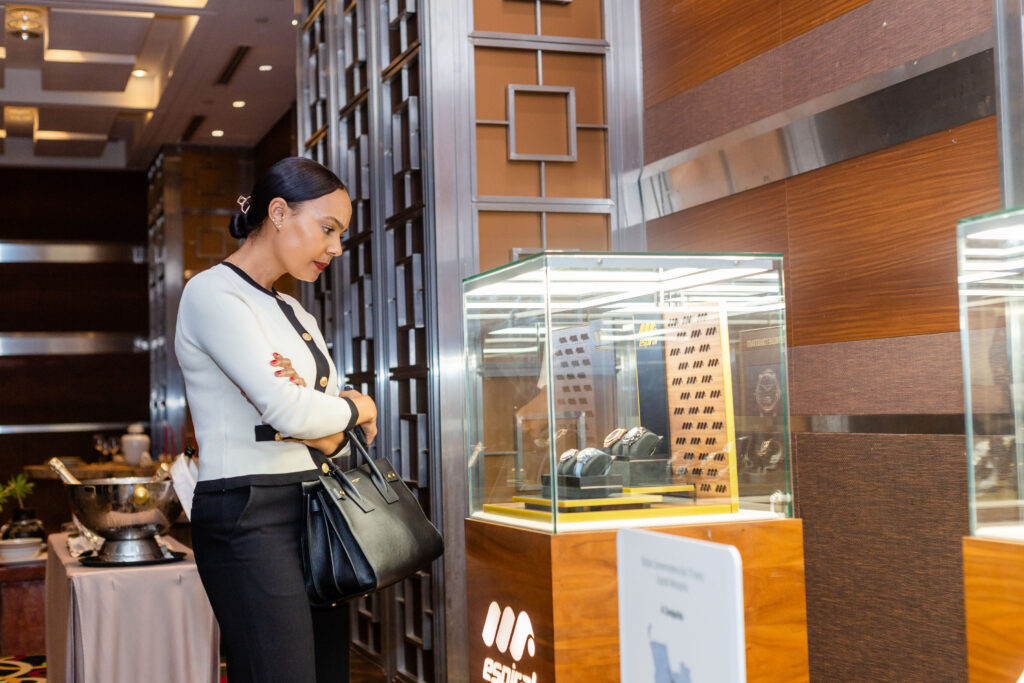 Woman looking at designer watch display